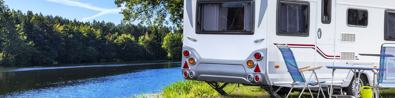 Trailer vehicle near a river, rv composite