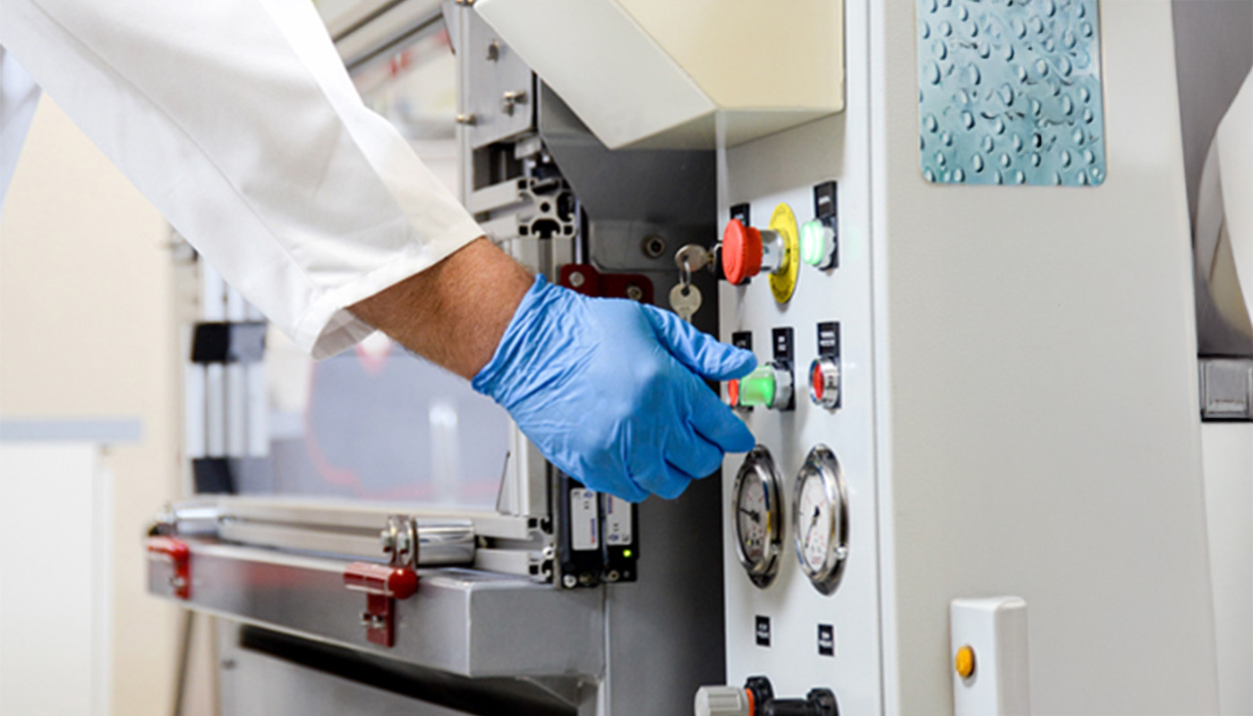 Man in a lab working a lab equipment for engineered stone