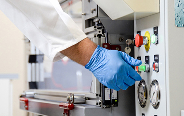 Man in a lab working a lab equipment for engineered stone